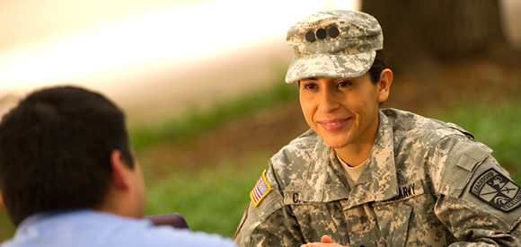 Female military student talking with male 