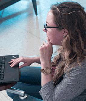 Female sitting working on laptop