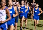 Male track students running 