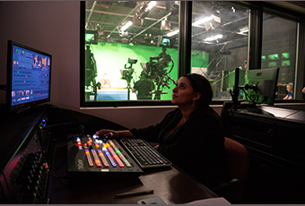 Mass communication professor in media center