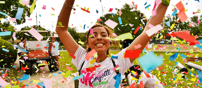 Female student with confetti falling