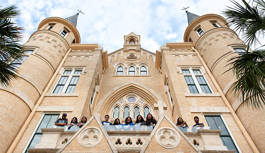Group of students above main building entrance