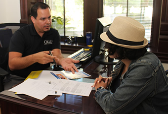 Counselor talking with student in office