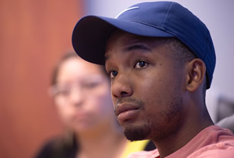 Male in class wearing baseball cap