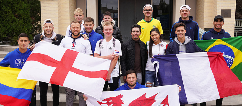 International students holding flags