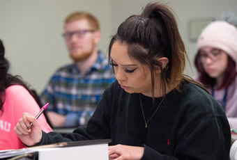 female-taking-class-notes