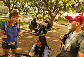 Students talking in the OLLU mall area