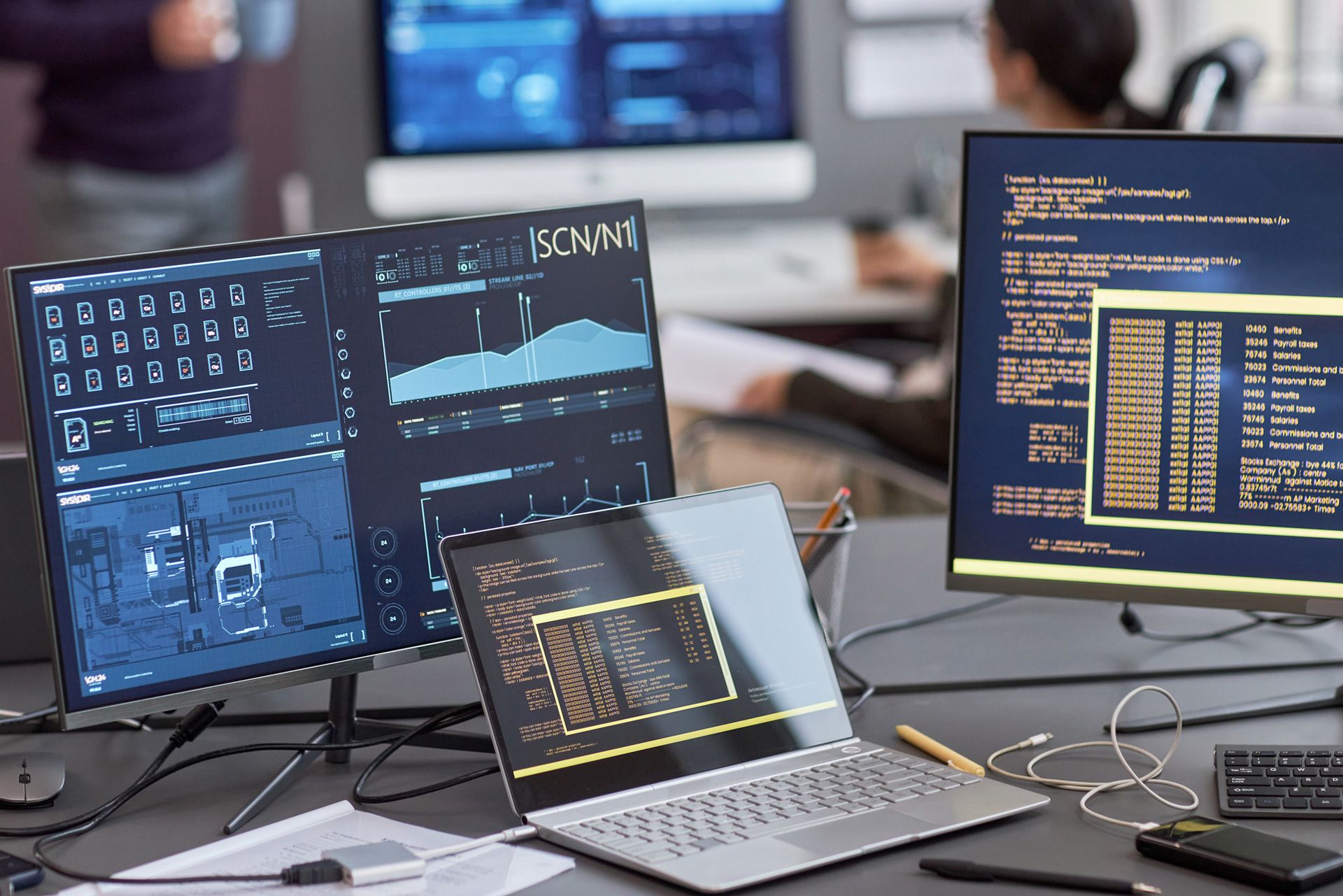 A student types on a laptop with technology-themed graphics symbolizing cloud computing, data, and networks—representing the blend of business and technology skills emphasized in Our Lady of the Lake University’s Computer Information Systems degree program.