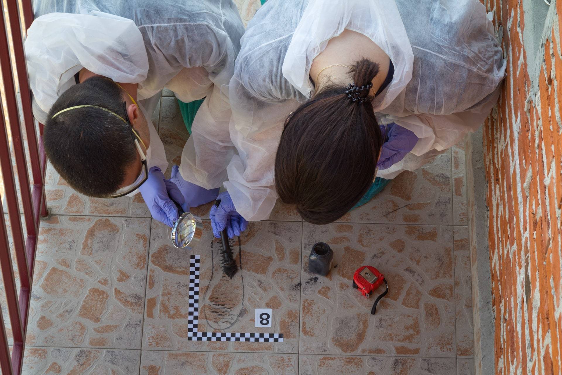 Criminology degree students engaging in hands-on crime scene investigation training.