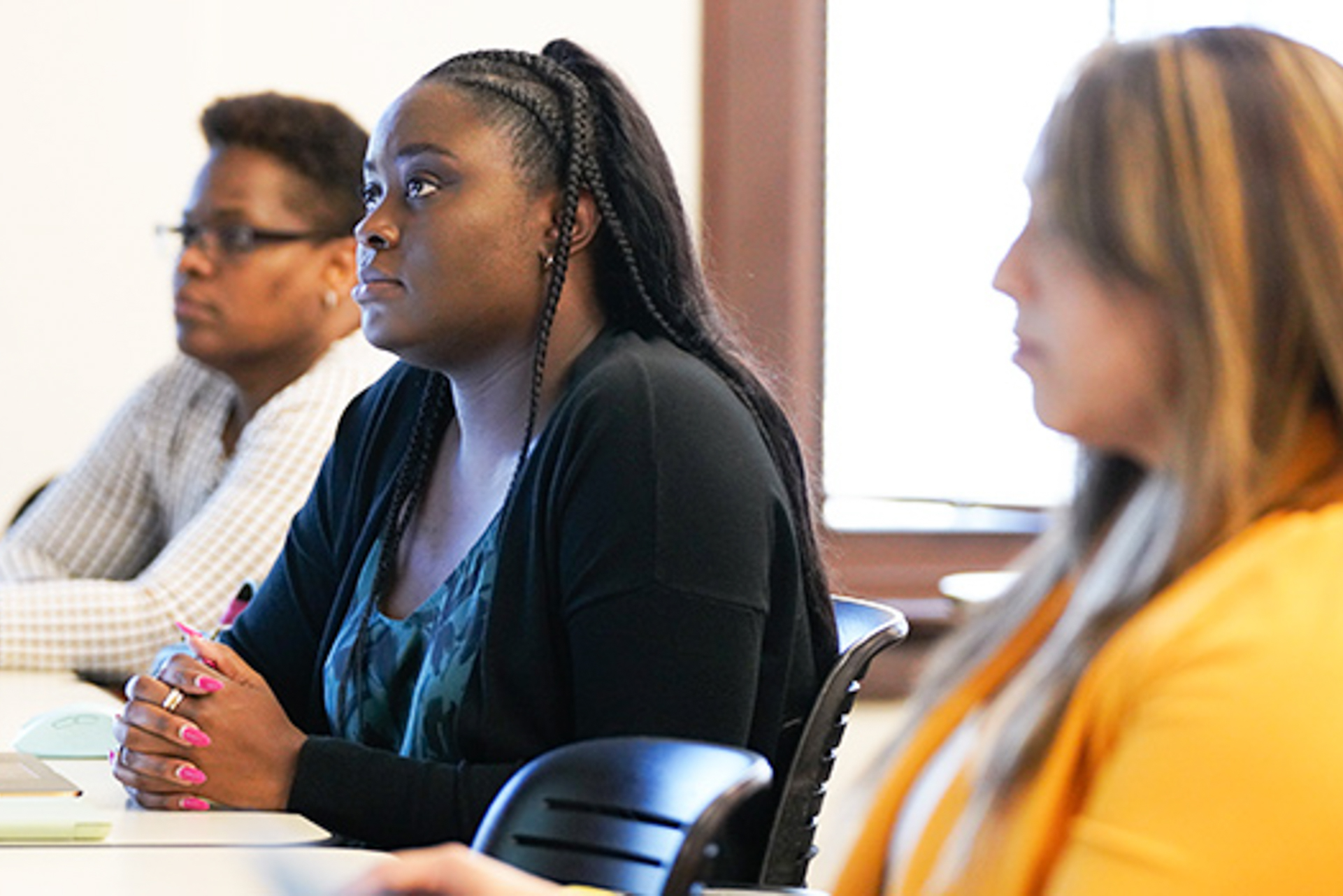 Graduate students in an OLLU classroom engaging in discussion, highlighting the MBA nonprofit leadership certificate program.