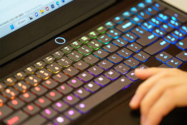 rgb_keyboard_lg Close-up of a colorful backlit keyboard, symbolizing cybersecurity studies and online learning opportunities at OLLU.