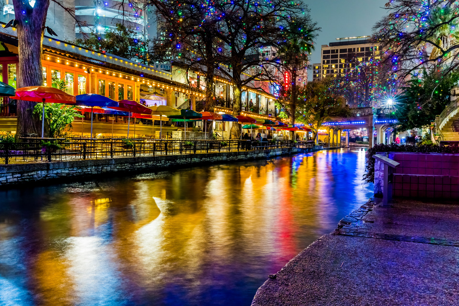 Night view of the San Antonio River Walk, showcasing the vibrant city atmosphere near Our Lady of the Lake University.