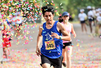 Male and Female running with confetti falling