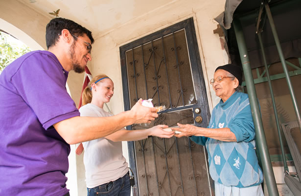 Female and male student handy elderly man food