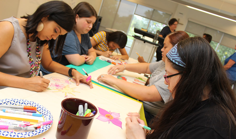 Group of female students drawing flowers