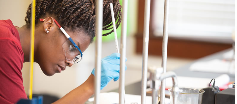 Female student working in science lab