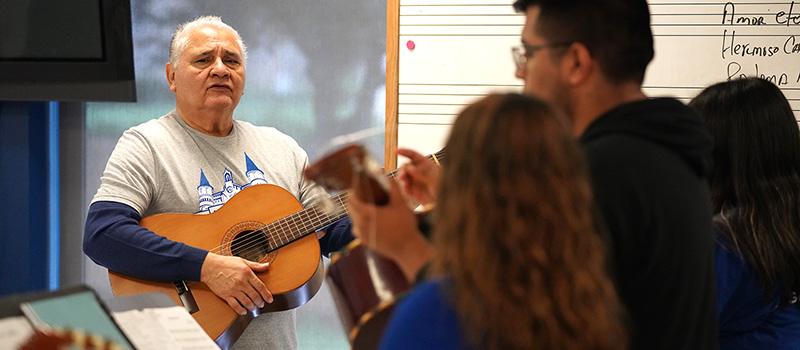 Students playing guitar