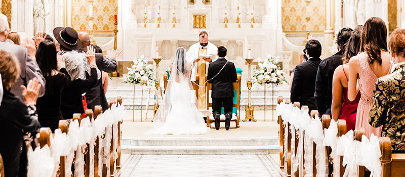 Couple in church at alter kneeling