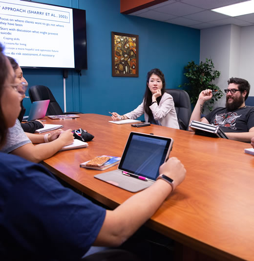 Students having discussion at conference table