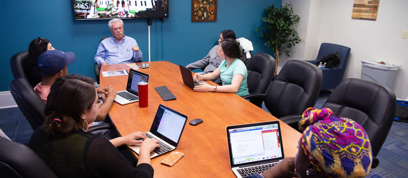 PsyD students completing study session with professor