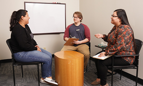 Students conducting patient interview