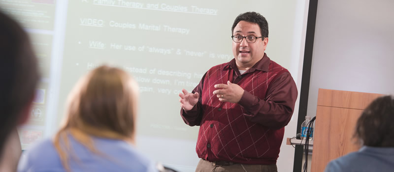 professor standing in front of class