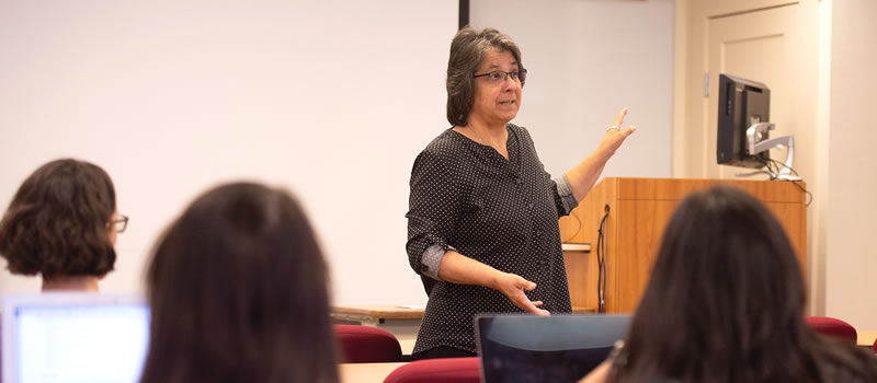 Female professor standing in front of class