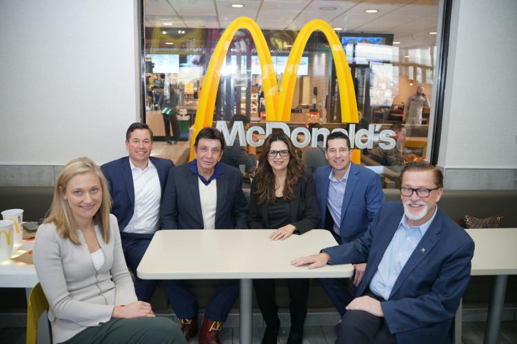 OLLU board member Richard Castro sits with president of McDonald's USA and others