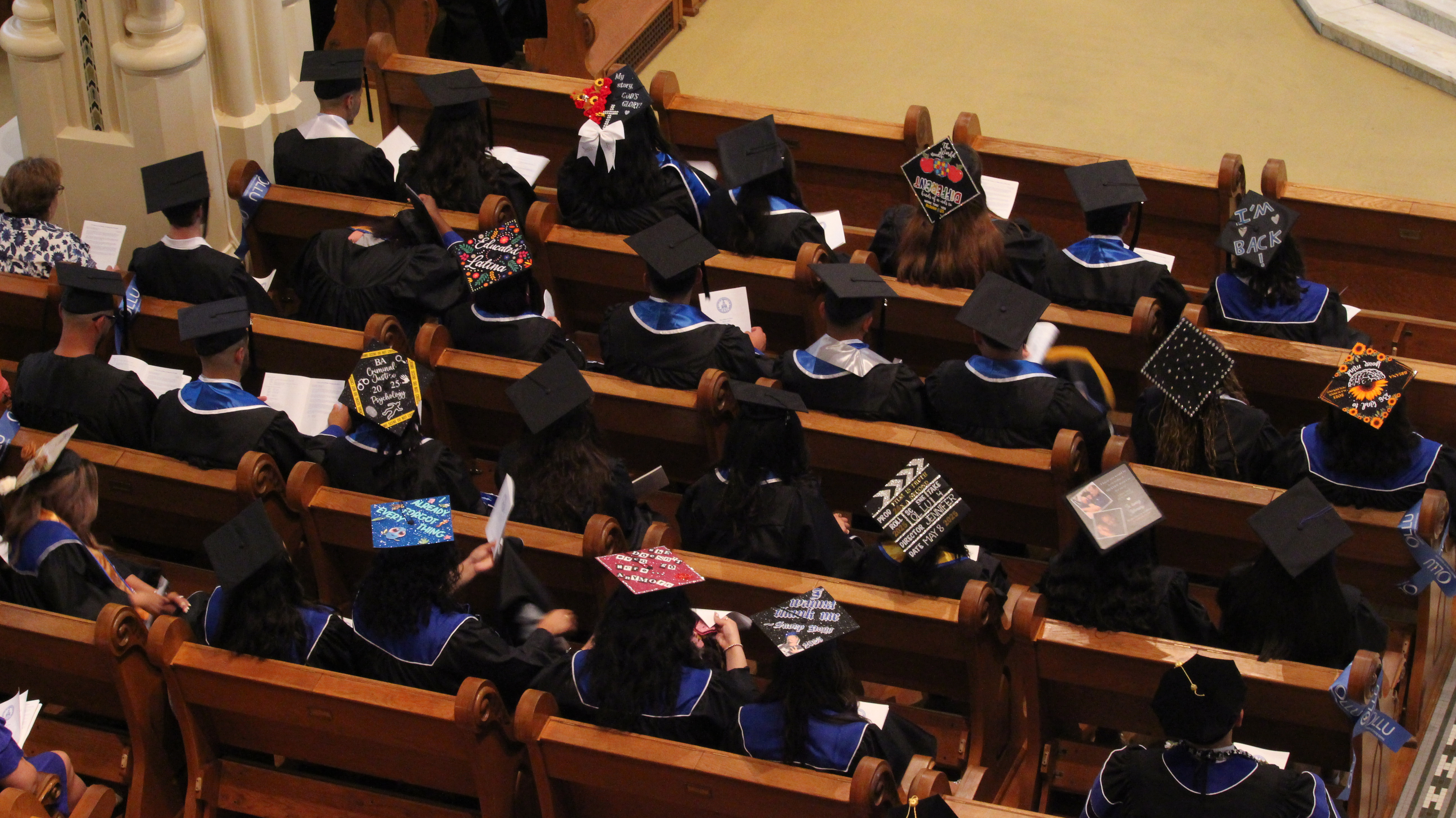 top view of students seated in chapel during grdaution mass
