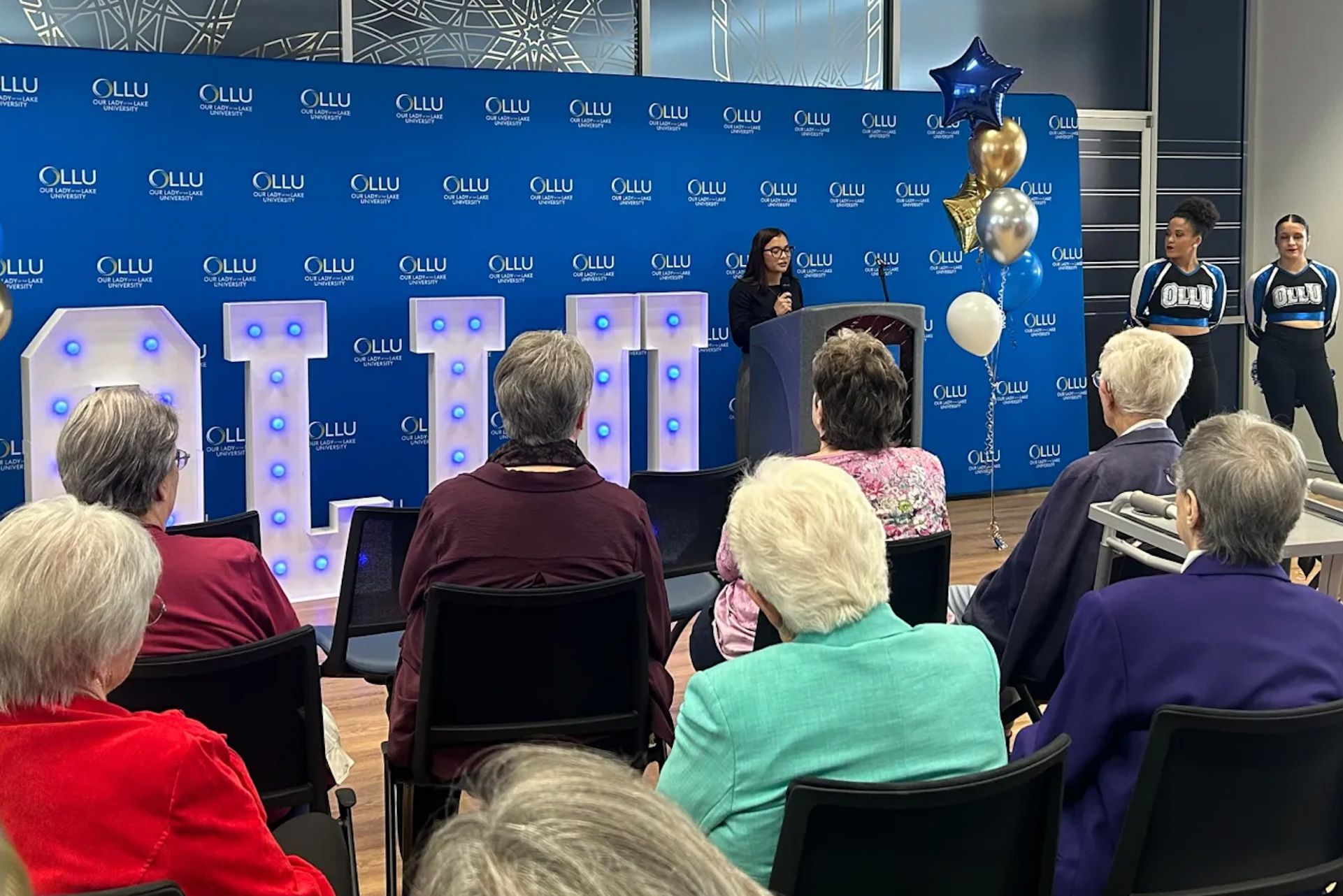 ollu-celebration-2-lg ollu student speaking at celebration event