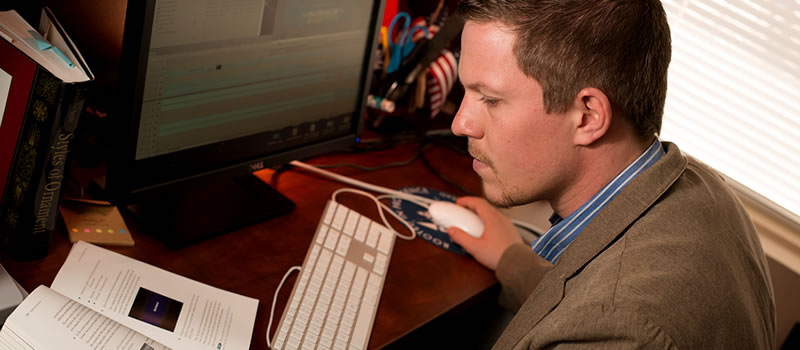 male studying at computer