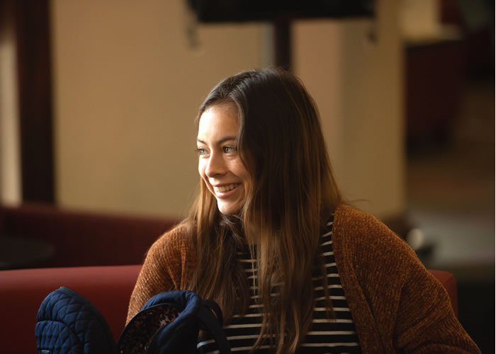 Female sitting smiling 