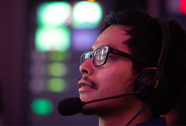 student in television studio wearing headset