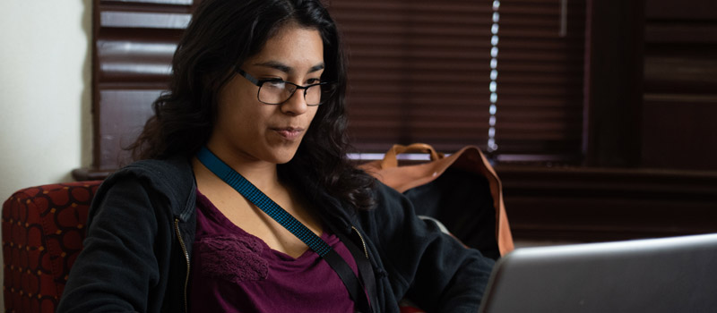 Female student working on laptop