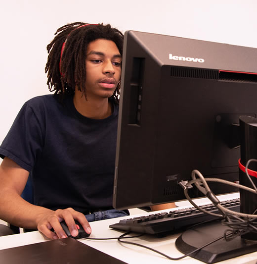 Student sitting at computer
