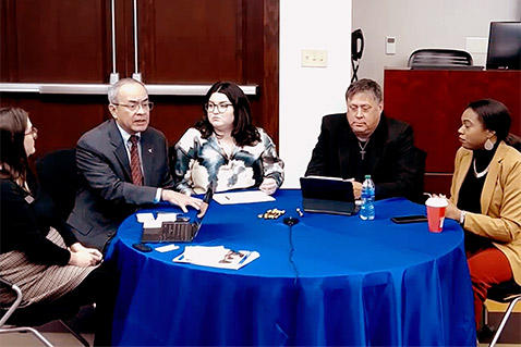 Panelist group talking at table