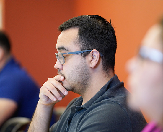 Student thinking and looking at what is in front of him