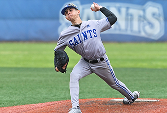 Male on field throwing baseball