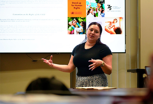 Student presenting in front of class